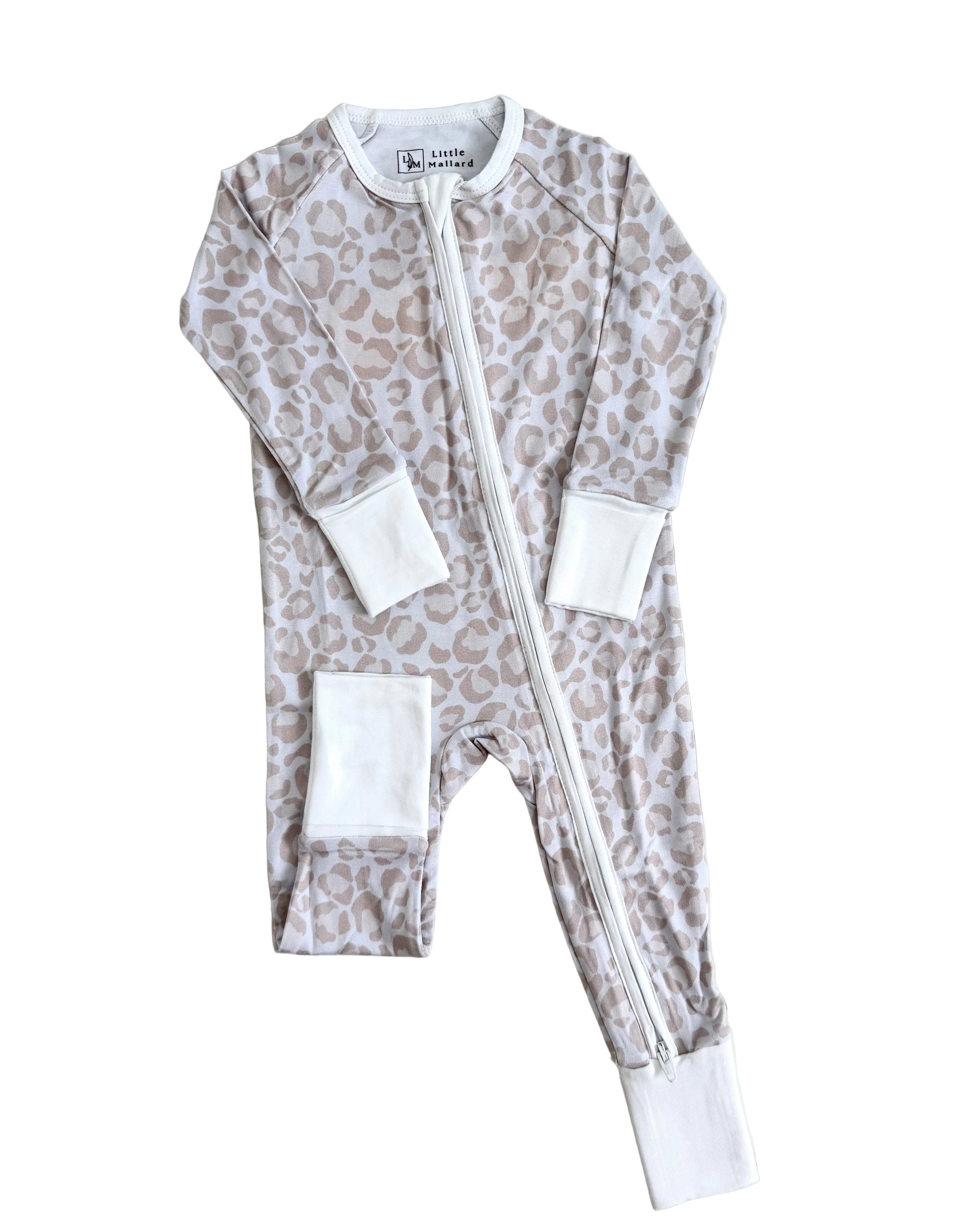 Baby onesie with leopard print and white accents on a white background. Pajama is soft and breathable bamboo pajamas 