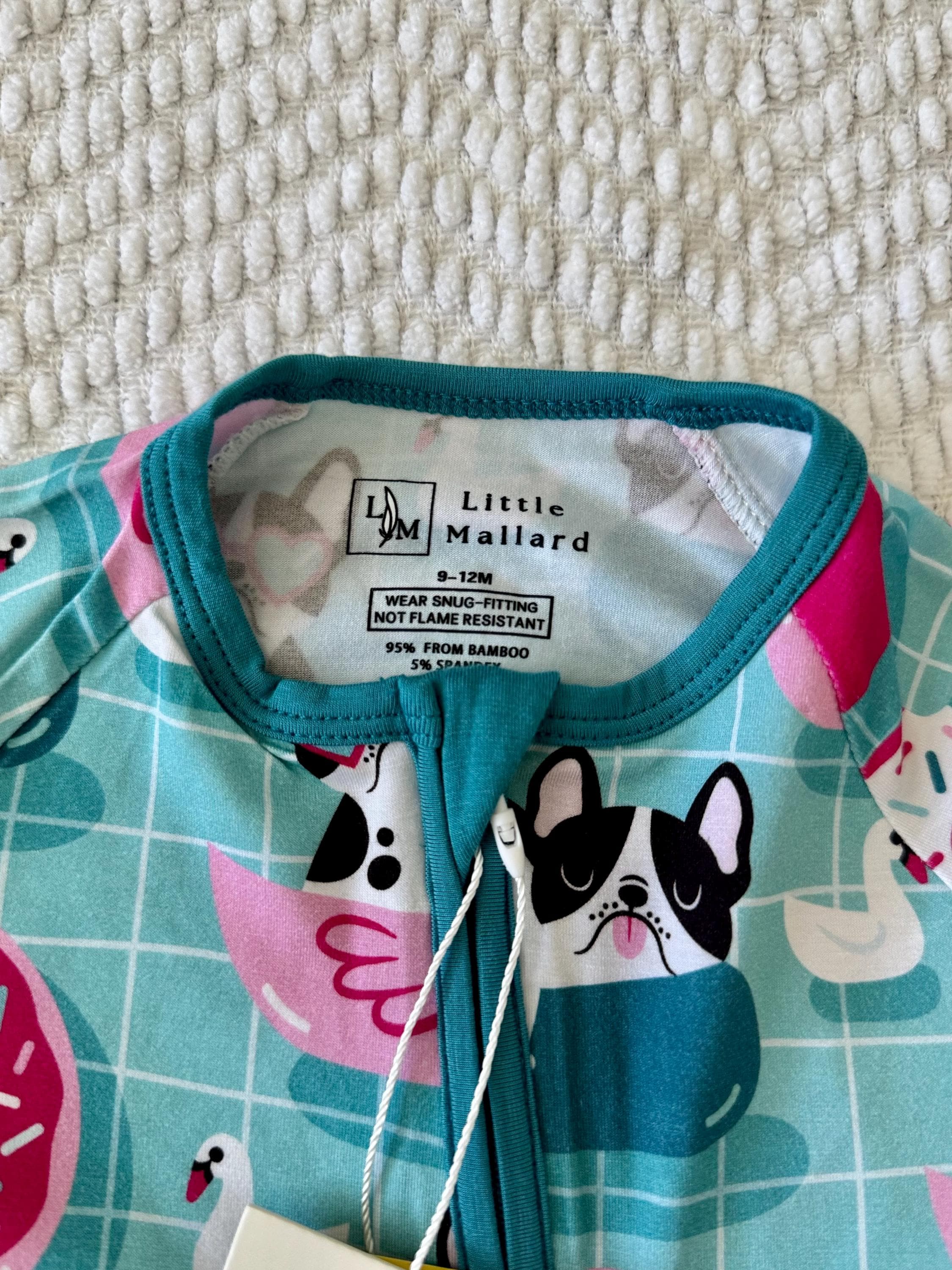 temperature regulating baby pajama with dog print on blue background designed by little mallard