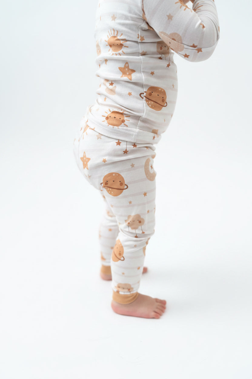 Bamboo toddler pajamas with space designs in neutral colors. Bamboo pajamas are super soft, breathable and comfortable. 