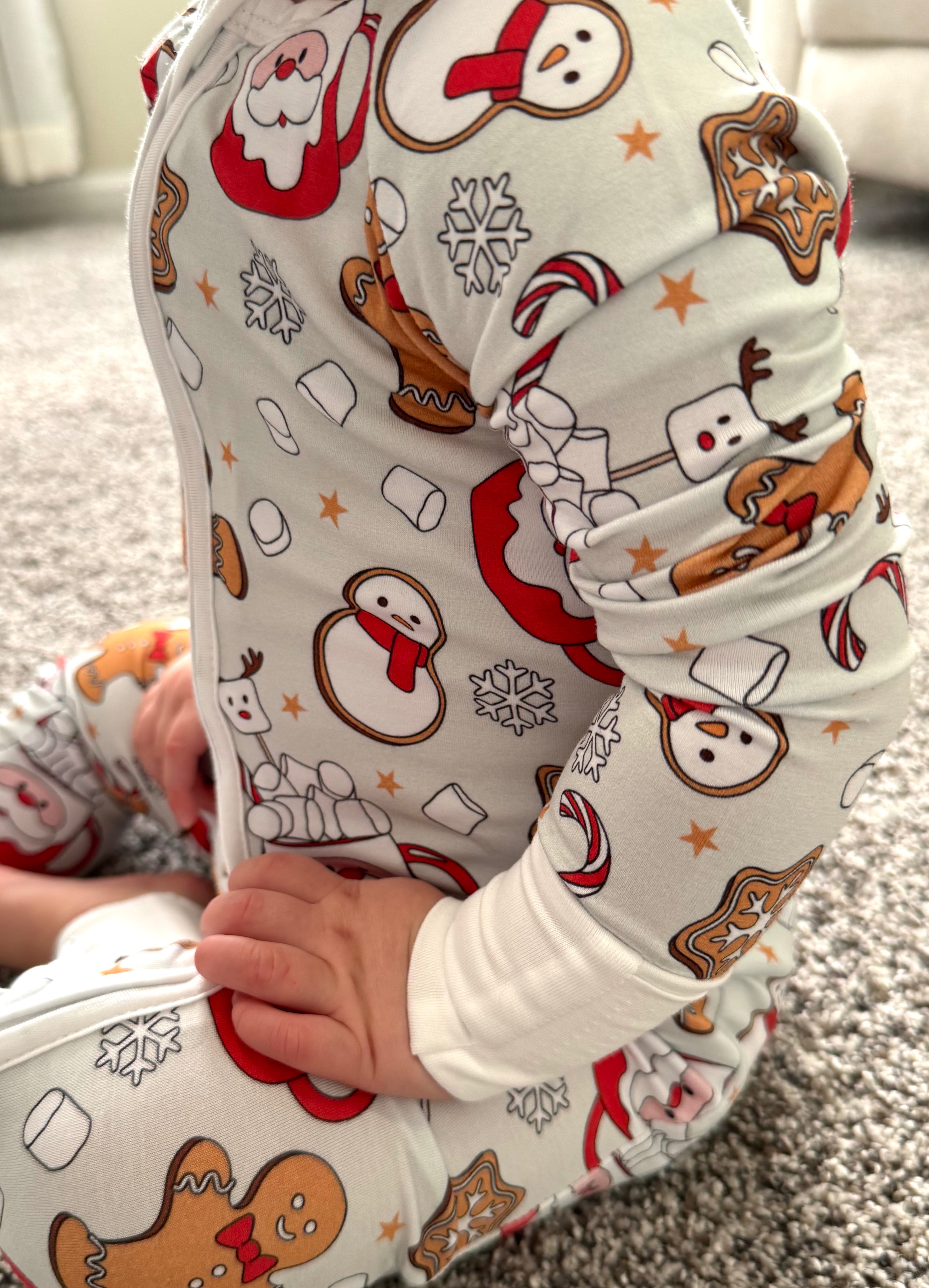 Baby wearing christnmas onesie-Bamboo christmas pajamas with Santa mug, candy canes, ginger bread cookies, marshmallows, snowflakes, cookies, snowman and more! The bamboo pajamas are so soft and great on sensitive skin. These footies have convertible mittens and footies to allow them to grow with your little one! Super soft romper, Soft onesie, soft sleeper, soft baby sleepwear. 