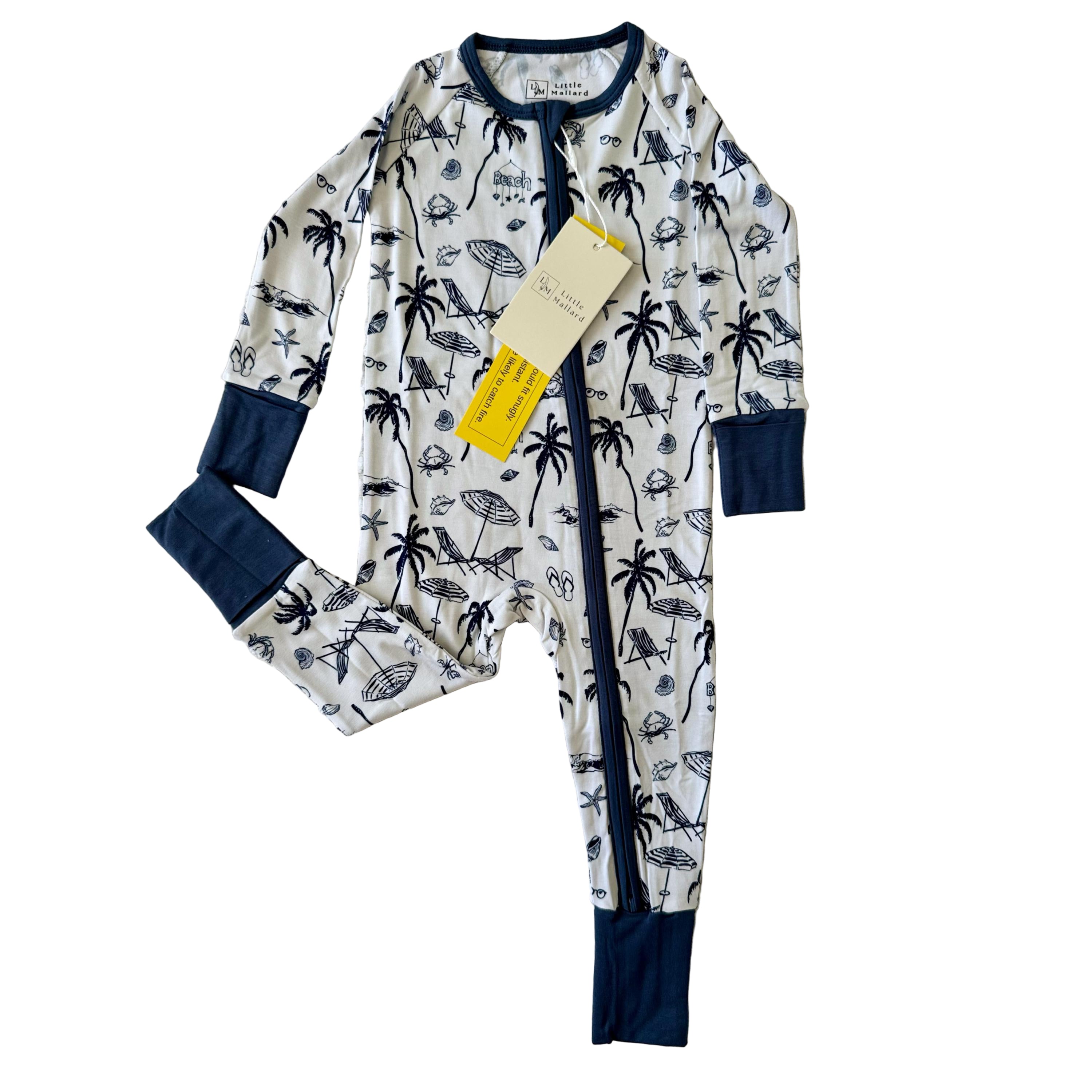 White soft bamboo convertible pajama with blue beach accents and blue zipper with foldable blue mittens and feet. 