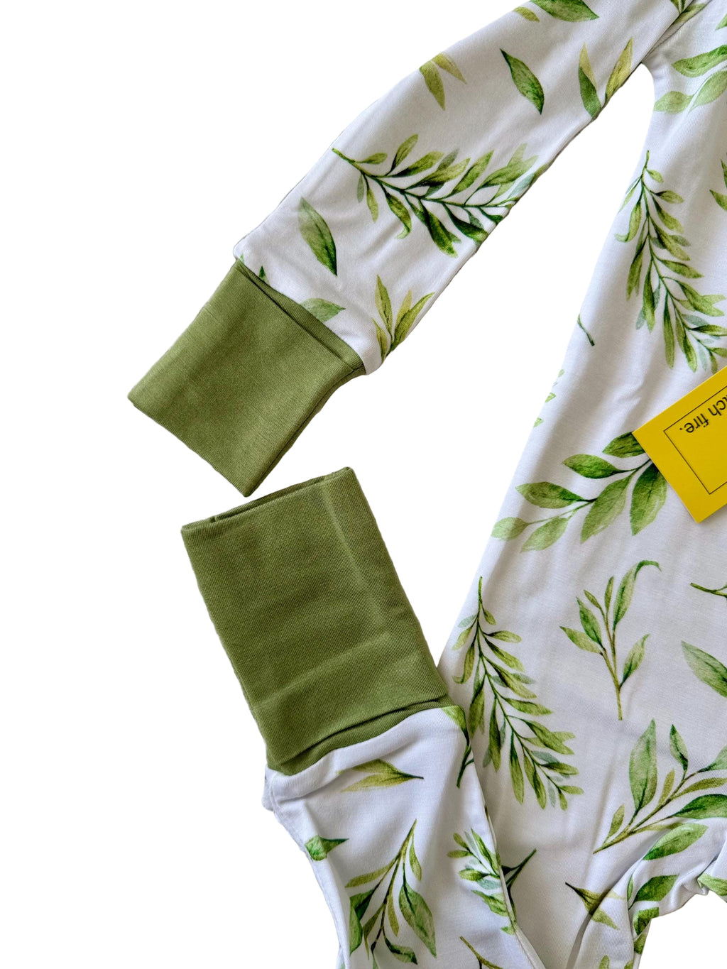 Green baby bamboo pajama with green leaf pattern and convertible mittens and footies. 