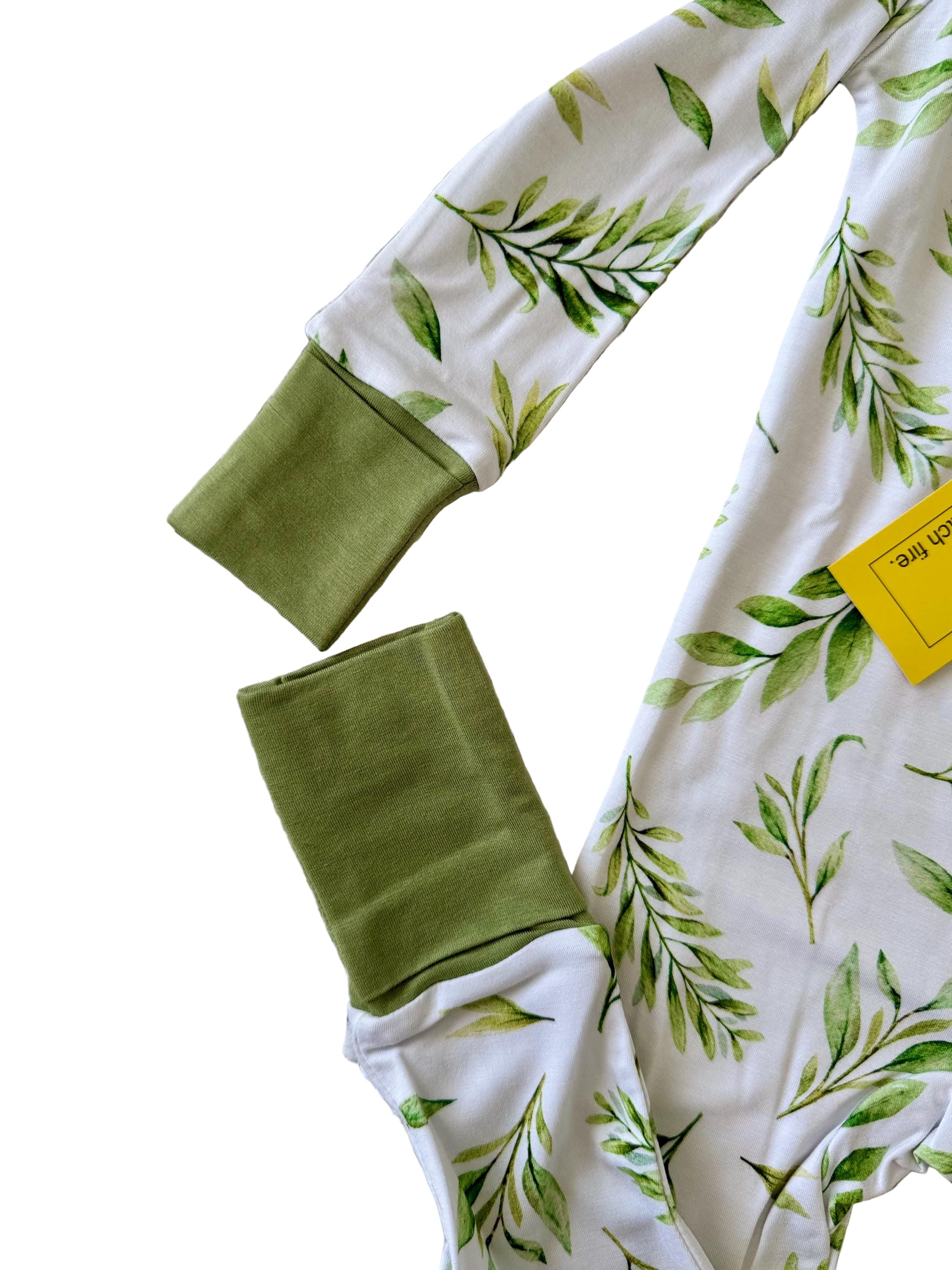 Green baby bamboo pajama with green leaf pattern and convertible mittens and footies. 