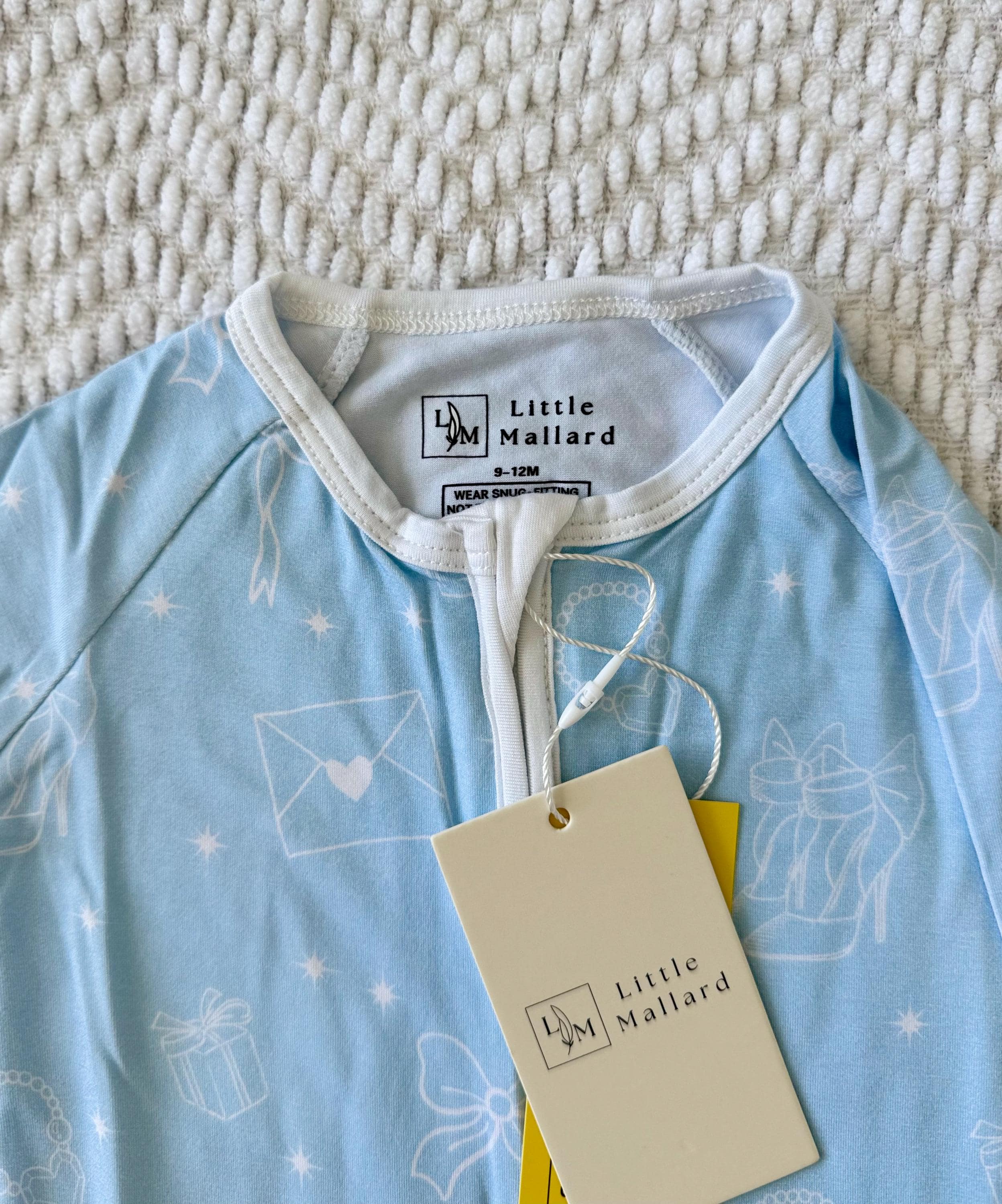 Light blue bamboo baby sleeper zipper with white girly accents. 