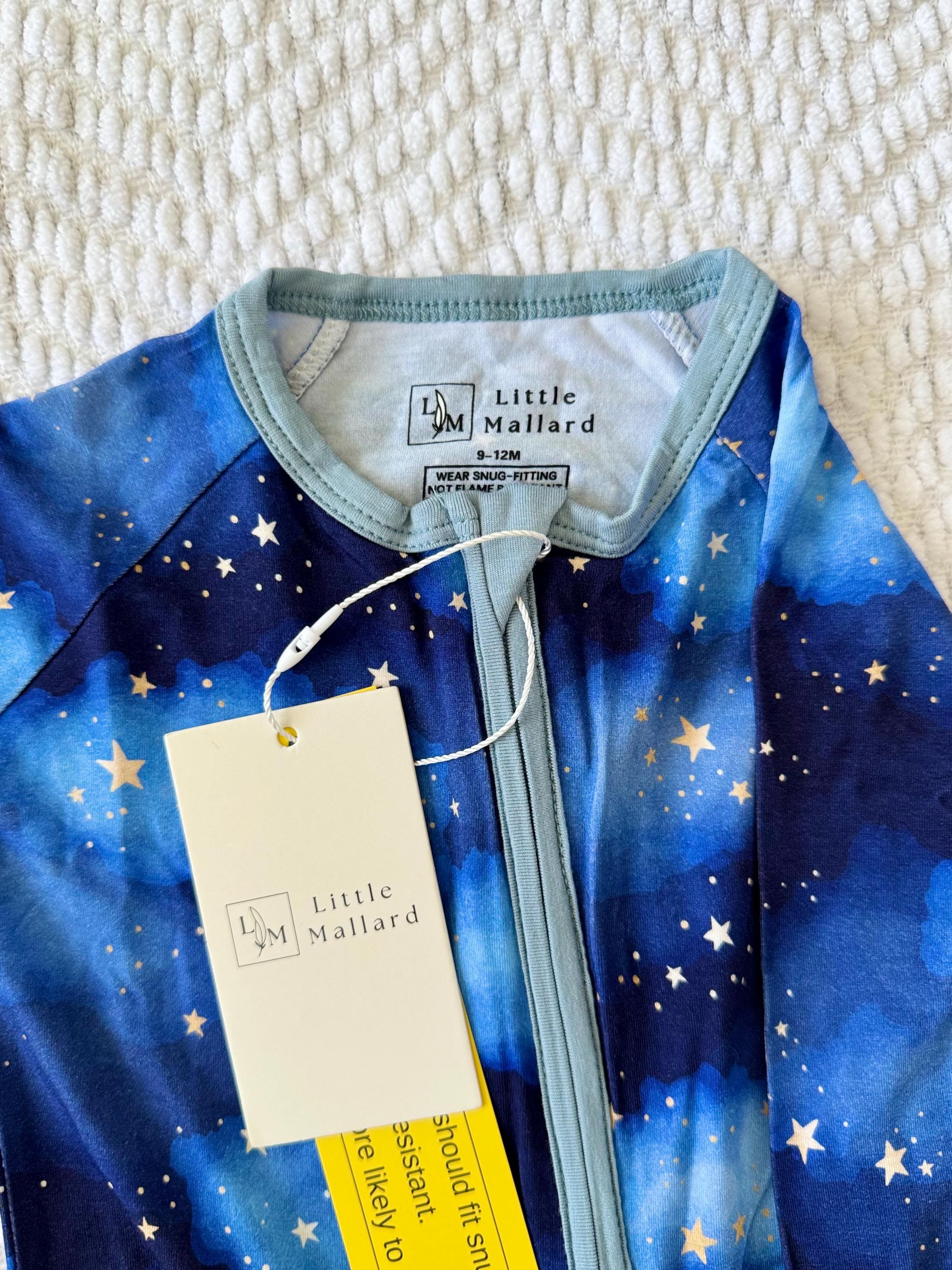 Soft baby convertible pajama/ onesie with galaxy pattern on a white background designed by Little Mallard